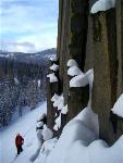 Skier at the base of the Postpile