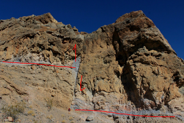 a rock face with a line down the middle, rock layers match but are offset by about 20 feet