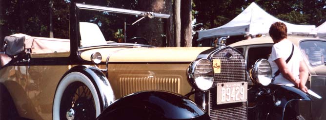 An antique auto at an outdoor show