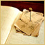A yellowed stack of small papers and  a spindle on a large  accounts book