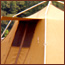 A tall tan camping tent