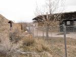 Metal construction fence installed in front of temporary visitor center.