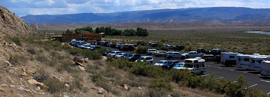 Vehicles fill the parking lot outside the Quarry Visitor Center.