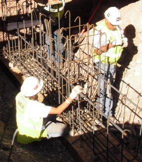 Workers install rebar at Quarry Exhibit Hall. 