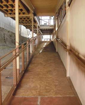 The railings along the ramp leading from the mezzanine to the main floor of the exhibit hall were recently painted brown. 