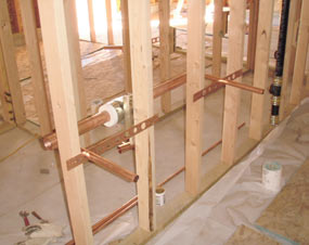 Rough plumbing work in Quarry Visitor Center.  