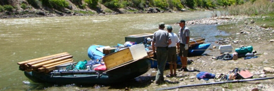 Rafts loaded with building materials to be removed from recommended wilderness. Rafts loaded with building materials to be removed from recommended wilderness.