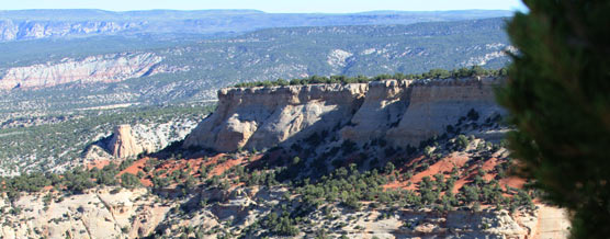 View of butte and colorful rock layers from Plug Hat Trail. 