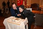 Photo of 2 Poe's blowing out candles on cake
