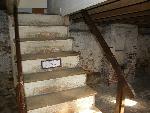 Photo of Staircase in basement of Poe's home