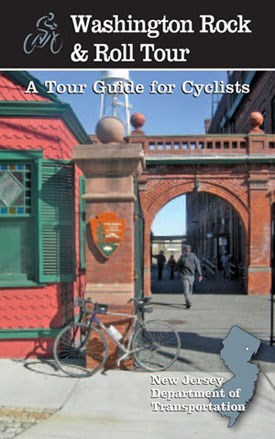 Brochure cover for bike tour with a bike leaning on a brick and concrete pillar at the park entrance.