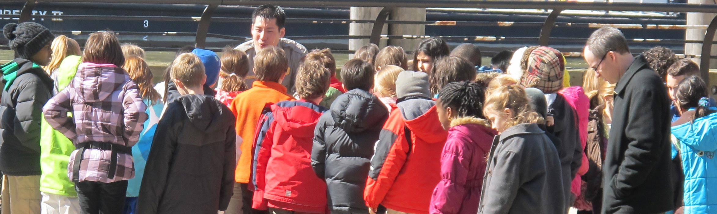 Ranger with Students on Ellis Island dock.