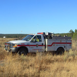 A wildland fire engine and crew patrols the park.