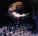 Cavers enter a lava tube.