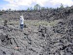 A hiker in a lava amphitheater.