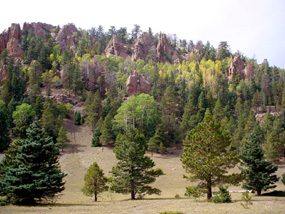 Volcanic spires rise from the north slope of Mount Taylor in the Cibola National Forest.