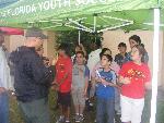 Firefighter talks to children
