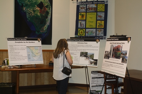 Visitor views Posters describing Fee Increase Proposal