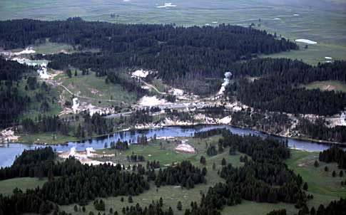 An aerial view shows Mud Volcano and the Yellowstone River