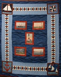 Patchwork quilt with nautical patterns and images.