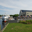 Patchogue Ferry Terminal and boat along river.