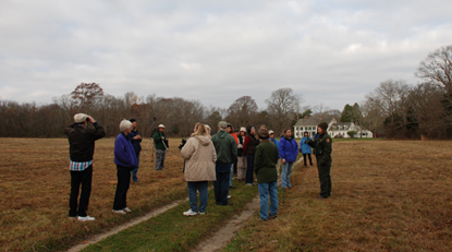 Group of fall birdwatchers on lawn of William Floyd Estate.