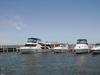 Four boats in slips at Sailors Haven marina.