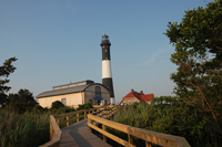 Boardwalk leading to Fresnel Lens Building and Fire Island Lighthouse.