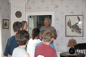 Group on tour inside historic home. Group on tour inside historic home.