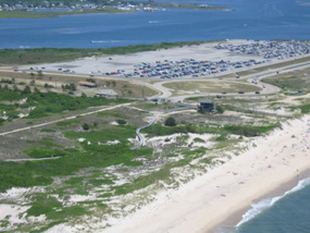Aerial view of Wilderness Visitor Center, with Smith Point County Park parking lot in background.