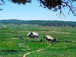 View of grassy meadows and historic buildings