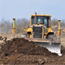 Bulldozer moving earth during Phase I construction.