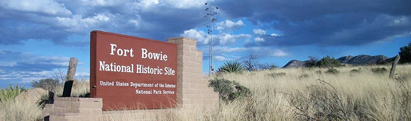 Entrance sign in grassland at Fort Bowie National Historic Site