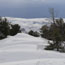 Snow begins to accumulate in November.  10-12 foot snow drifts cover the upper road from December through April.