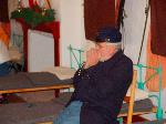 A soldier in the barracks playing the harmonica
