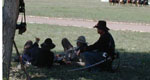 Soldiers at rest under a tree.