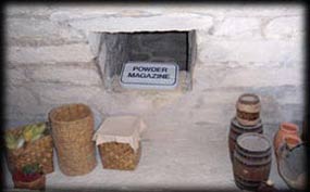 The powder magazine kept the gunpowder safe and dry behind thick walls.