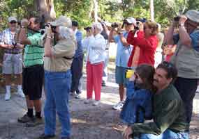 People of all ages enjoying a bird walk at Fort Matanzas National Monument.