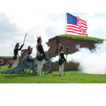 The Fort McHenry Guard fires a cannon.