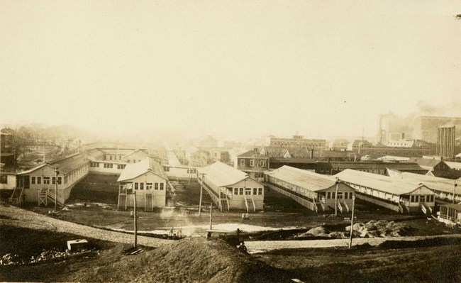 A black and white photograph showing large buildings that were constructed for the hospital.