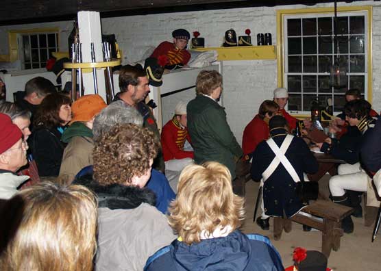 Visitors learn about yuletide activities within a fort.