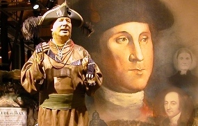 Exhibit showing American Indian presenting wampum