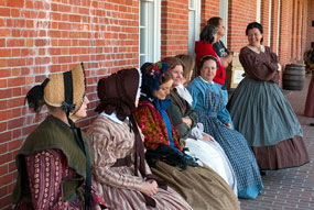 19th-century lkiving historians portraying the  wives of the 48th New York Infantry Regiment.