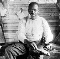 John Franks Wise, a Freedmen's Colony descendant, reenacts a freedman's trade - cobbling.