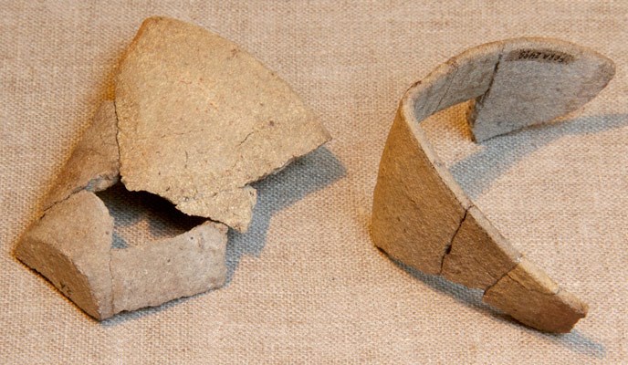 Crucible artifact in two pieces on display in the Fort Raleigh Visitor Center.