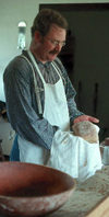 Soldier baking bread in the bakehouse.
