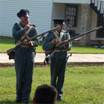 Site volunteers giving weapons demonstration during Labor Day weekend of 2005