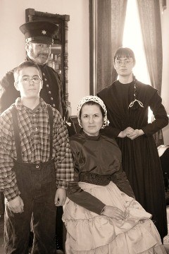Reenactors portraying an officer, his wife and their children