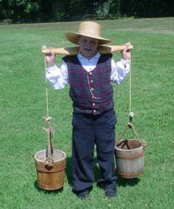 Child with yoke and buckets