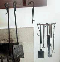 Fireplace tools from left to right. Poker, Ash Shovel, Pothooks, Spatula, Meat Fork, Trammel, Meat Fork